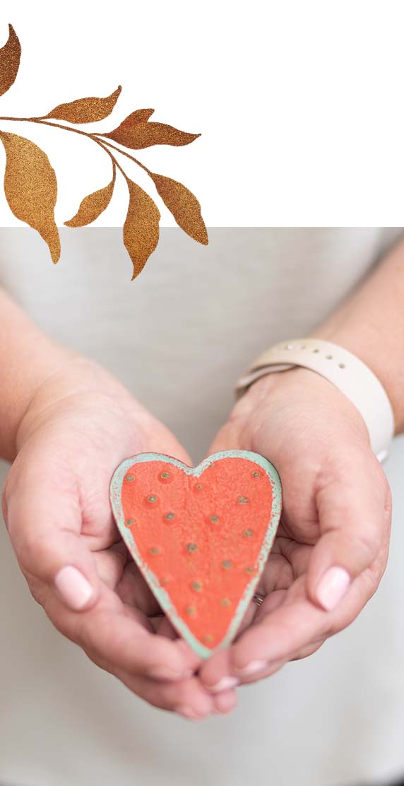 Sandy Mitsch's logo featuring a heart design